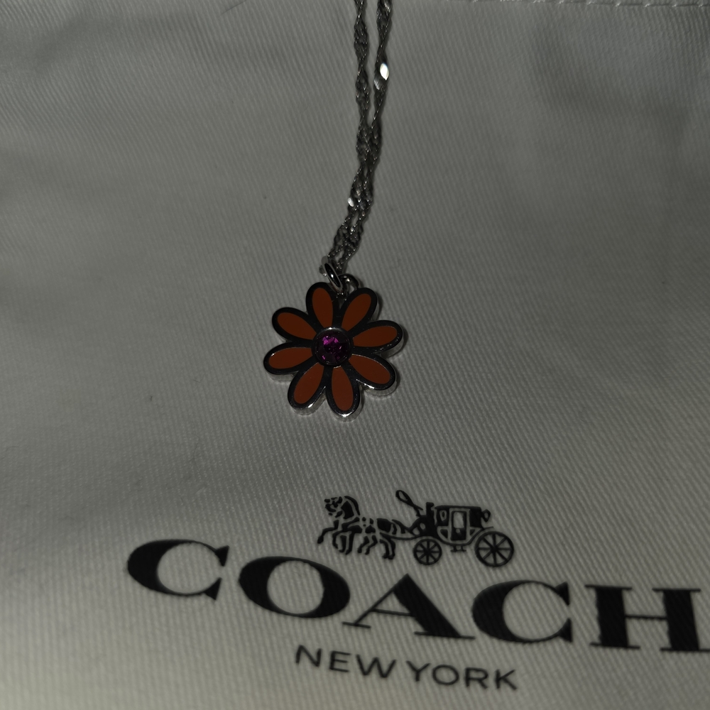 COACH Silver And Orange Daisy Pendant Necklace - Picture 2 of 6